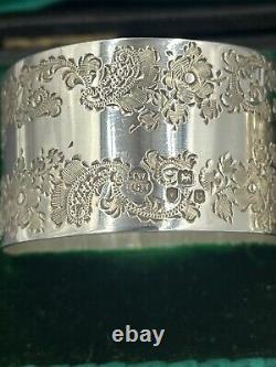 A nice pair of hand engraved sterling silver napkin rings in fitted case 1898/08
