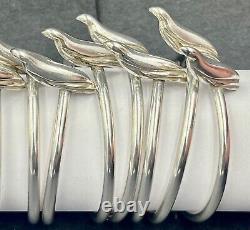 A set of 8 modern sterling silver napkin rings with seals 925