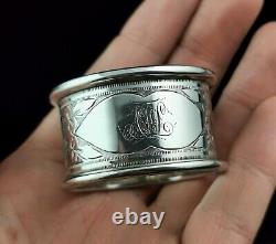 Antique sterling silver napkin ring, Floral engraved