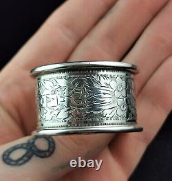 Antique sterling silver napkin ring, Floral engraved