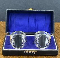 Pair of pierced sterling silver napkin rings in fitted case Birmingham 1919