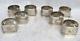 Set Of 8 Sterling Silver Figural High Relief Napkin Rings